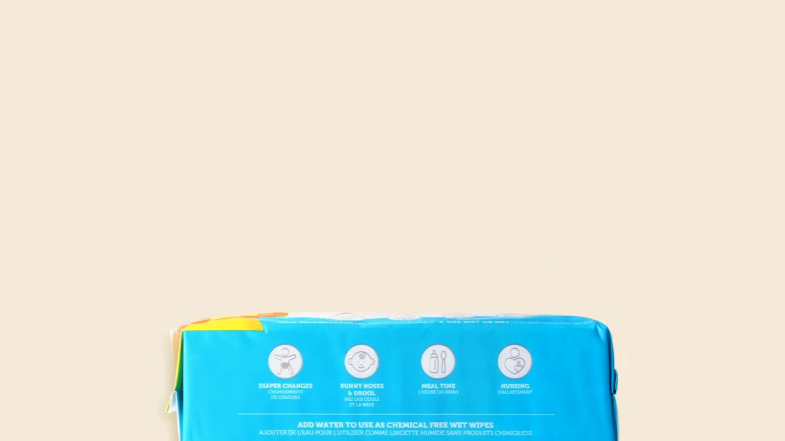 A pack of Whoopsie Wipes on a plain warm ground
